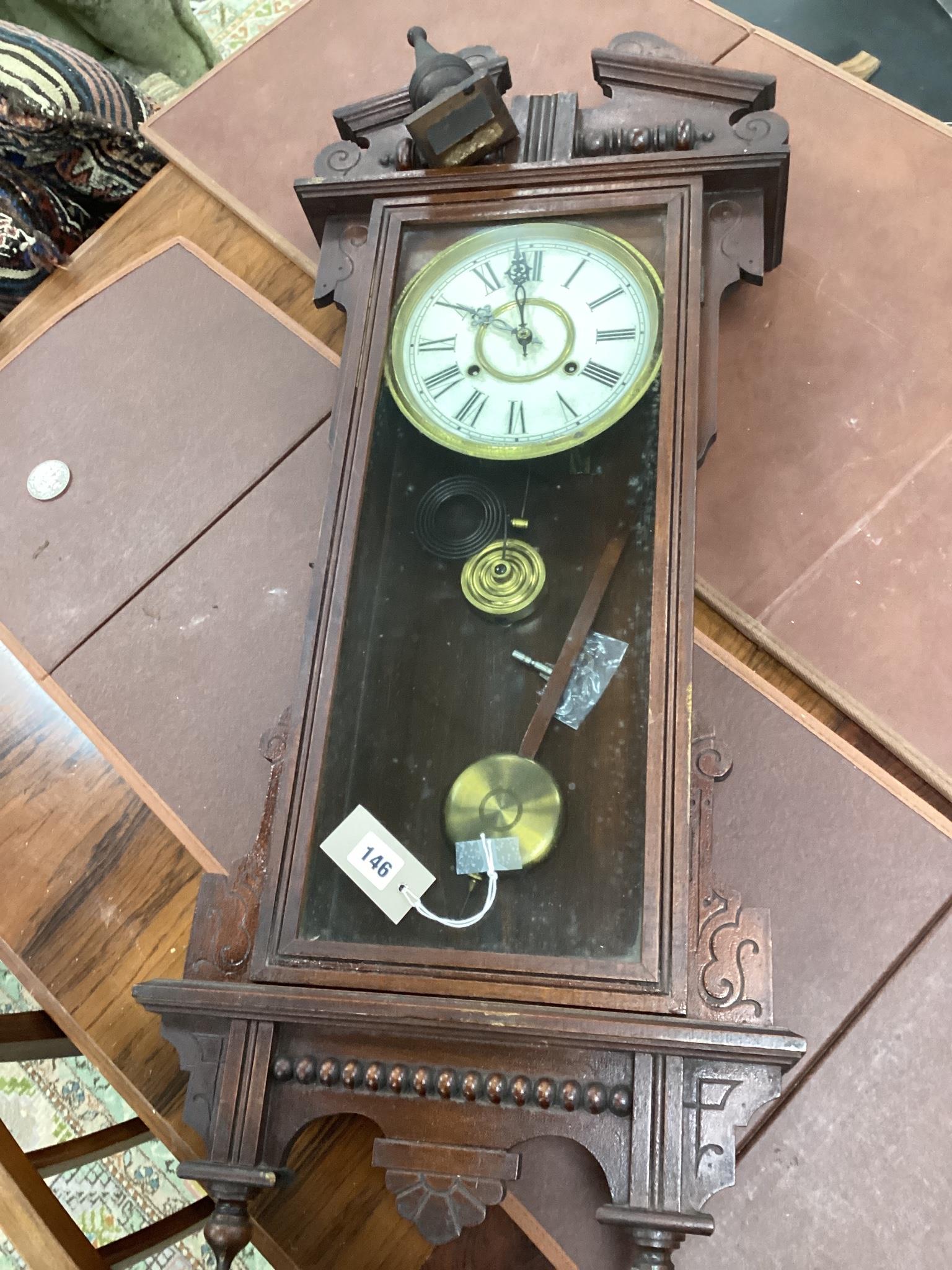 An early 20th century American Waterbury Clock Company wall clock, height 100cms